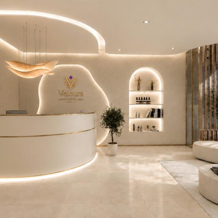 The Veloura reception — a sculpted counter beneath the brand mark