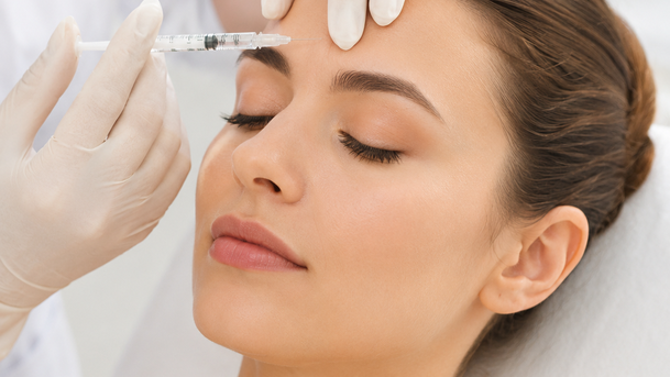 A precise botulinum toxin injection being administered during a Botox treatment