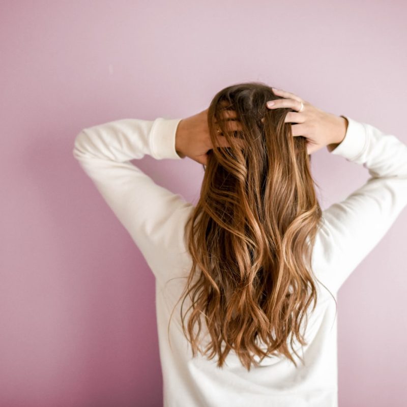 A hairbrush and morning light, illustrating everyday hair shedding