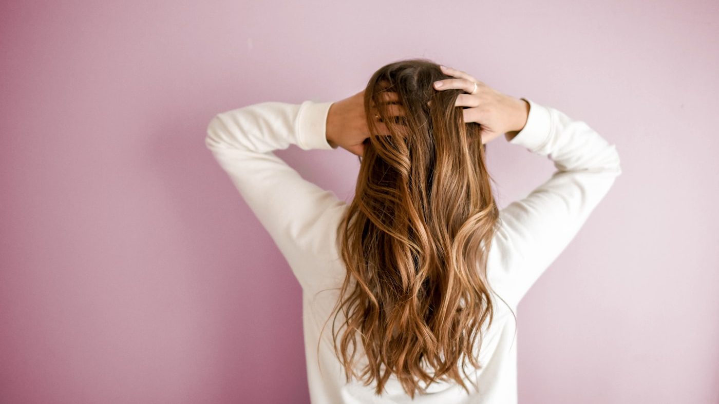 A hairbrush and morning light, illustrating everyday hair shedding