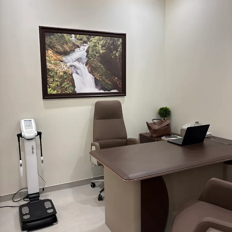 Assessment room at Veloura Clinic Gurgaon with a doctor’s desk and an InBody body composition analyser
